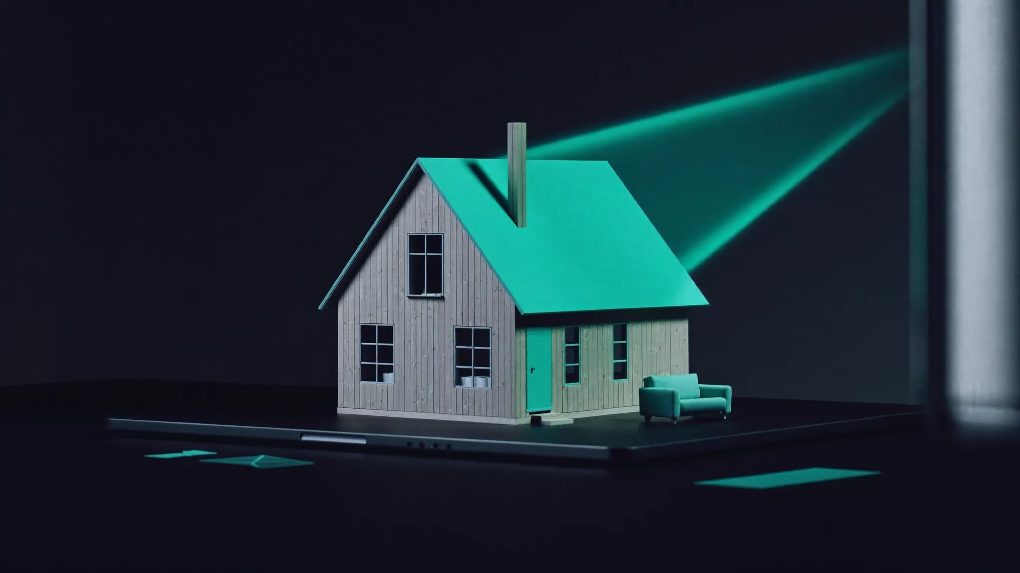 Casa in miniatura sul trackpad: vendere web marketing ai settori della casa